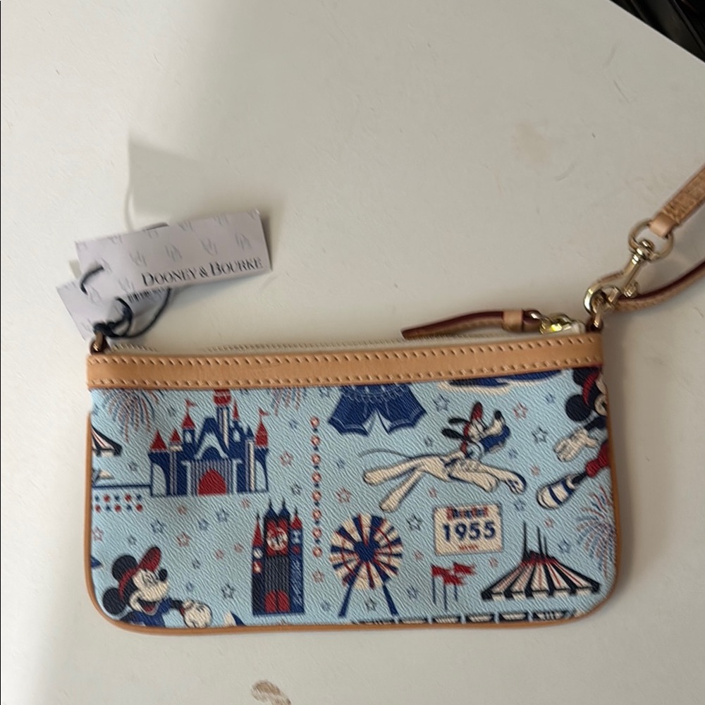 Dooney & Bourke Blue and Tan Wristlet with Theme Park Icons - Picture 2 of 3